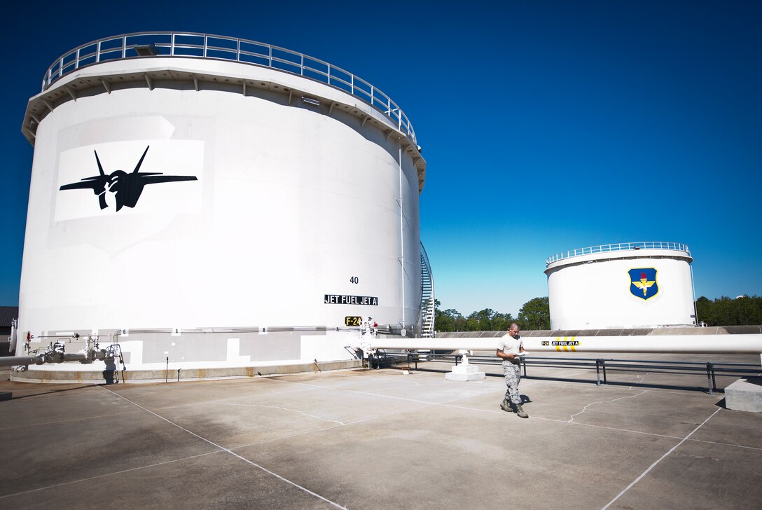 Staff Sgt. Aaron Fachini, the 96th Fuels Flight, completes his inspection of the 1.1 million gallon fuel tanks on the 33rd Fighter Wing side of Eglin Air Force Base, Fla May 6.  The tanks are inspected daily for operation, leaks and corrosion control measures.  The 131 Airmen and civilians of the fuels flight fall under the 96th Logistics Readiness Squadron and were recently named best fuels flight in Air Force Materiel Command.  (U.S. Air Force photo/Samuel King Jr.)