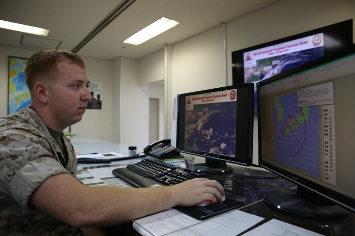 Lance Cpl. David Lightsey, a Meteorology and Oceanography forecaster with the Marine Corps Air Station Iwakuni Weather Services Branch, observes a tropical cyclone brief for a Typhoon Ready Exercise aboard MCAS Iwakuni, May 15, 2014.  In preparation for Typhoon Season, United States Forces Japan conducted the TR Exercise to increase tropical cyclone preparedness, evaluate notification procedures as well as responding procedures and also to raise public awareness.