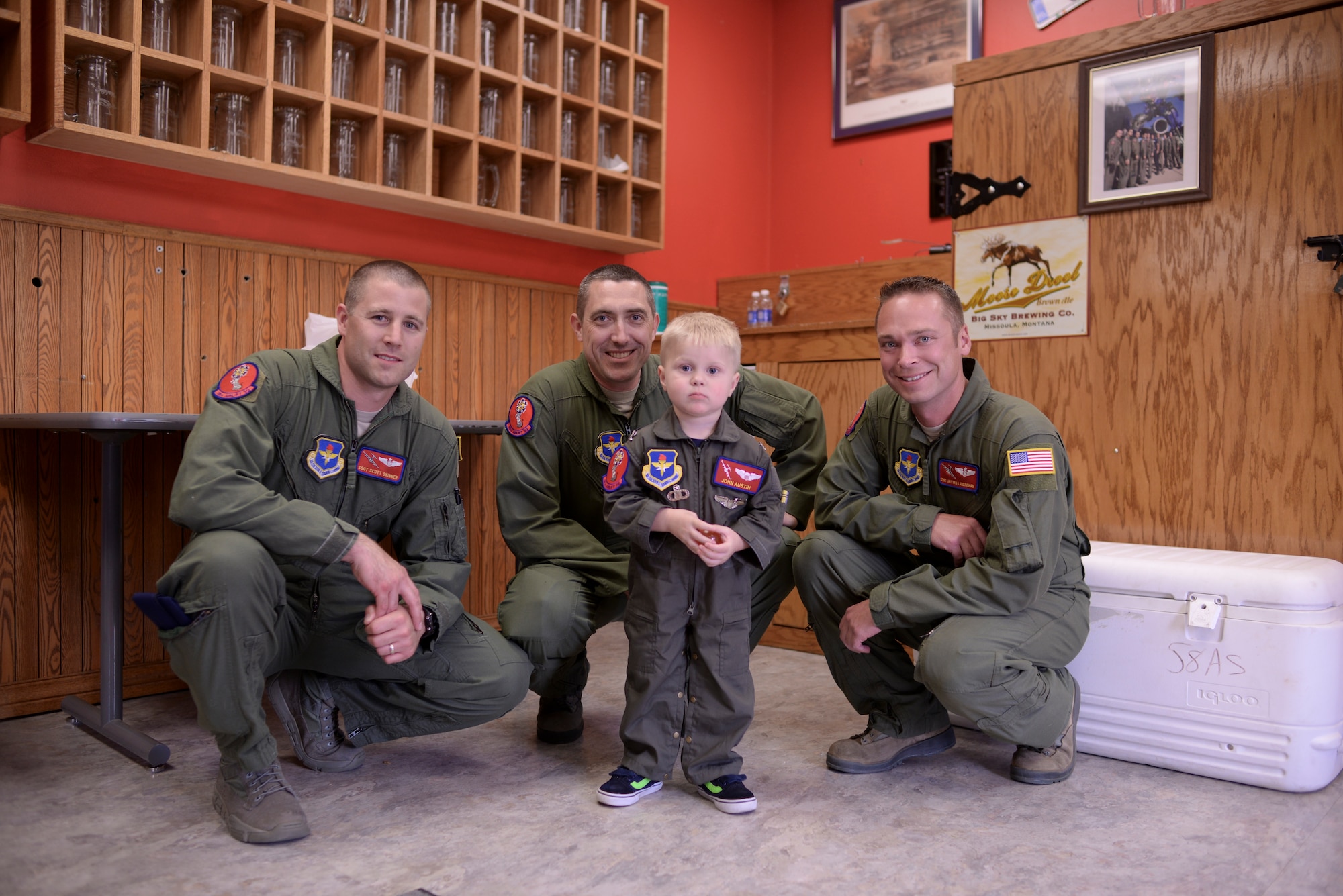 Two-year-old John Austin stands with members of the 58th Airlift Squadron May 15, 2014, at Altus Air Force Base, Oklahoma. Master Sgt. Keith Hackney of the 58th AS coordinated with other squadrons on base to make John’s day full of excitement and adventure. (U.S. Air Force photo/Staff Sgt. Nathanael Callon)