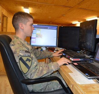 U.S. Army Spc. Christopher Chavez, an intelligence analyst for Alpha Company, 4th Brigade Special Troops Battalion, 4th Brigade Combat Team, 1st Cavalry Division, monitors his computers in the Tactical Operations Center at Forward Operating Base Gamberi, Laghman province, Afghanistan, Jan. 7, 2013. Cyber warfare continues to take on more importance.