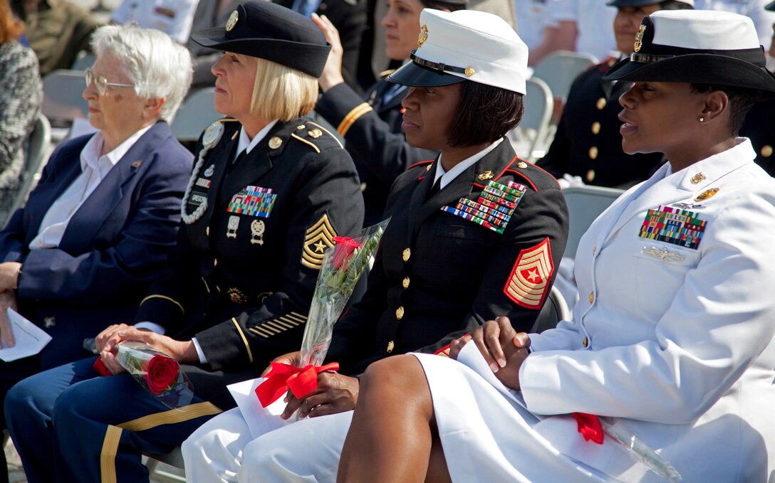 Sgt. Major Lanette Wright, the 24th Marine Expeditionary Unit sergeant major, listens to a speech given by a member of the Congressional Caucus for Woman's Issues during their military wreath laying ceremony at the Women in Military Service for America Memorial, Arlington, Virginia, May 20, 2014. The caucus recognized Wright as an outstanding female Marine senior enlisted staff non-commissioned officer.