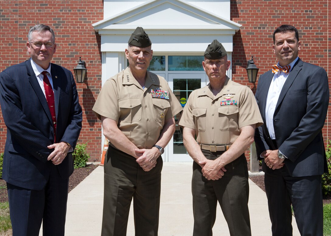 From the left, Mr. William Taylor; the Assistant Commandant of the Marine Corps, Gen. John M. Paxton, Jr.; Brig. Gen. Frank L. Kelley; Mr. James Smerchansky, pose for a photo at Marine Corps Systems Command, Marine Corps Base Quantico, Va., May 13, 2014. (U.S. Marine Corps photo by Cpl. Tia Dufour/Released)