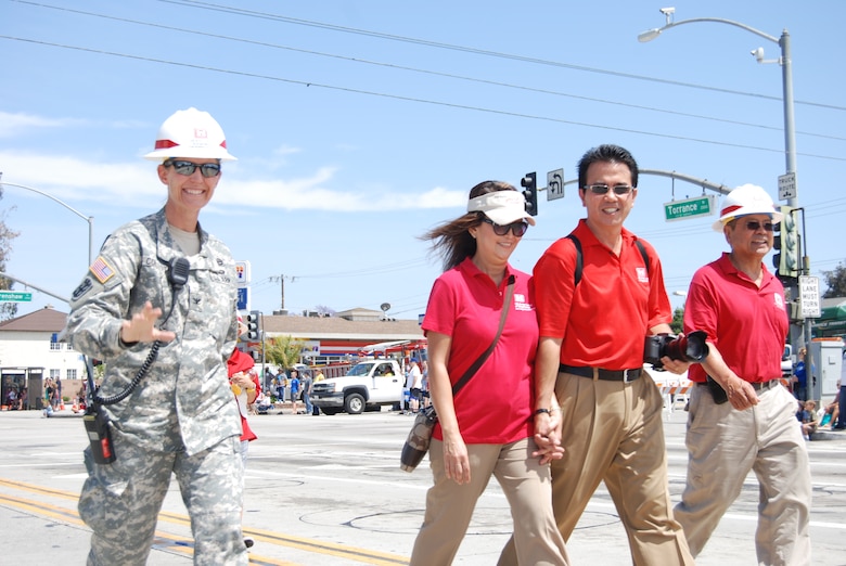 Col. Kim Colloton, commander of the Corps' Los Angeles District, Carol and Ed DeMesa, and Glenn Arikaki pass the official starting point of the Torrance Armed Forces Day Parade. A dozen district members joined the colonel in celebrating the contributions and sacrifices members of the Armed Forces have made for the nation.