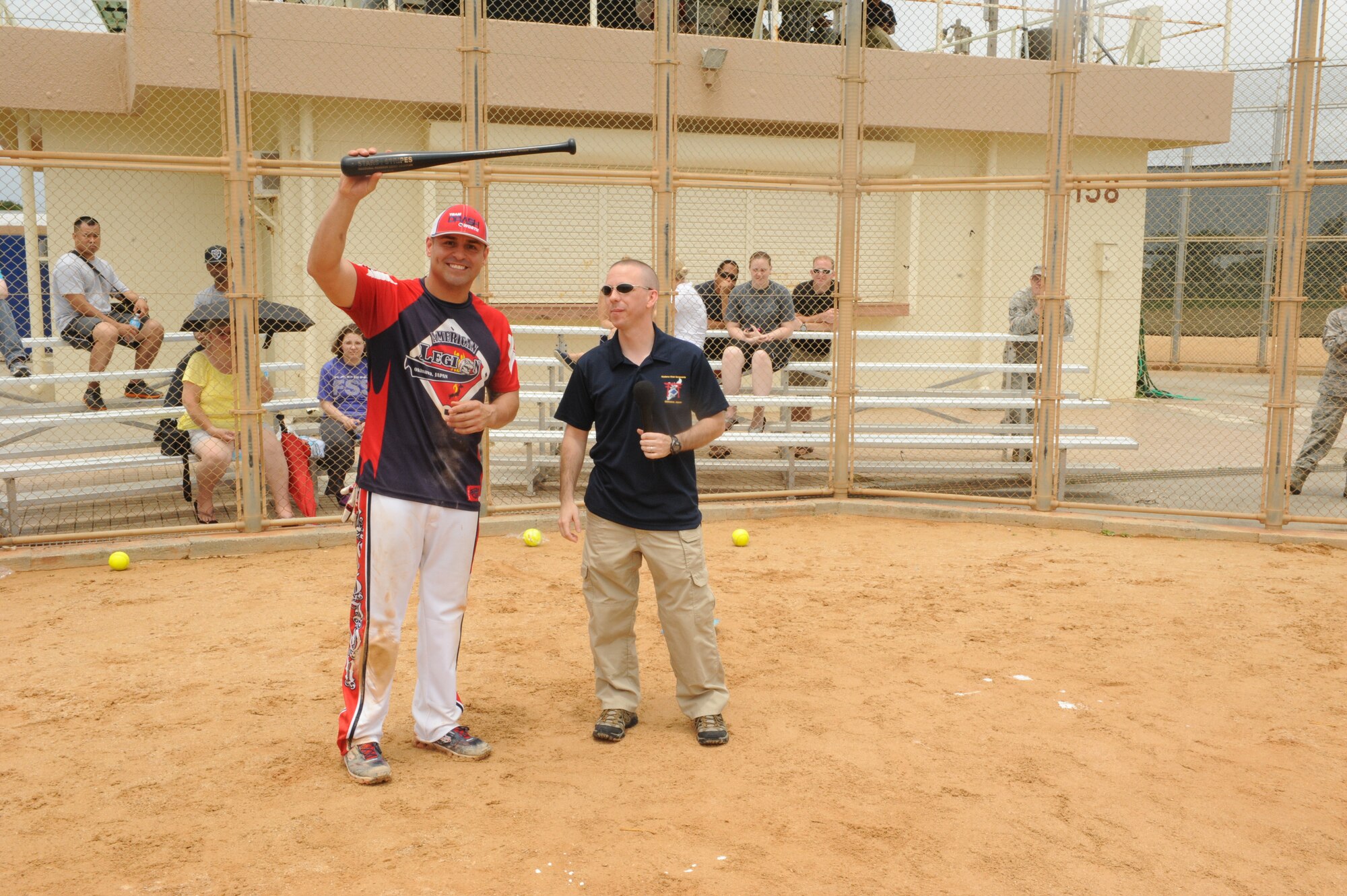 U.S. Air Force Tech. Sgt. Antonio Rivera, 31st Rescue Squadron resource advisor, accepts his trophy bat for winning the home run derby on Kadena Air Base, Japan, May 19, 2014. Rivera hit 8 of 10 balls out of the field to win the derby. (U.S. Air Force photo by Airman 1st Class Stephen G. Eigel)