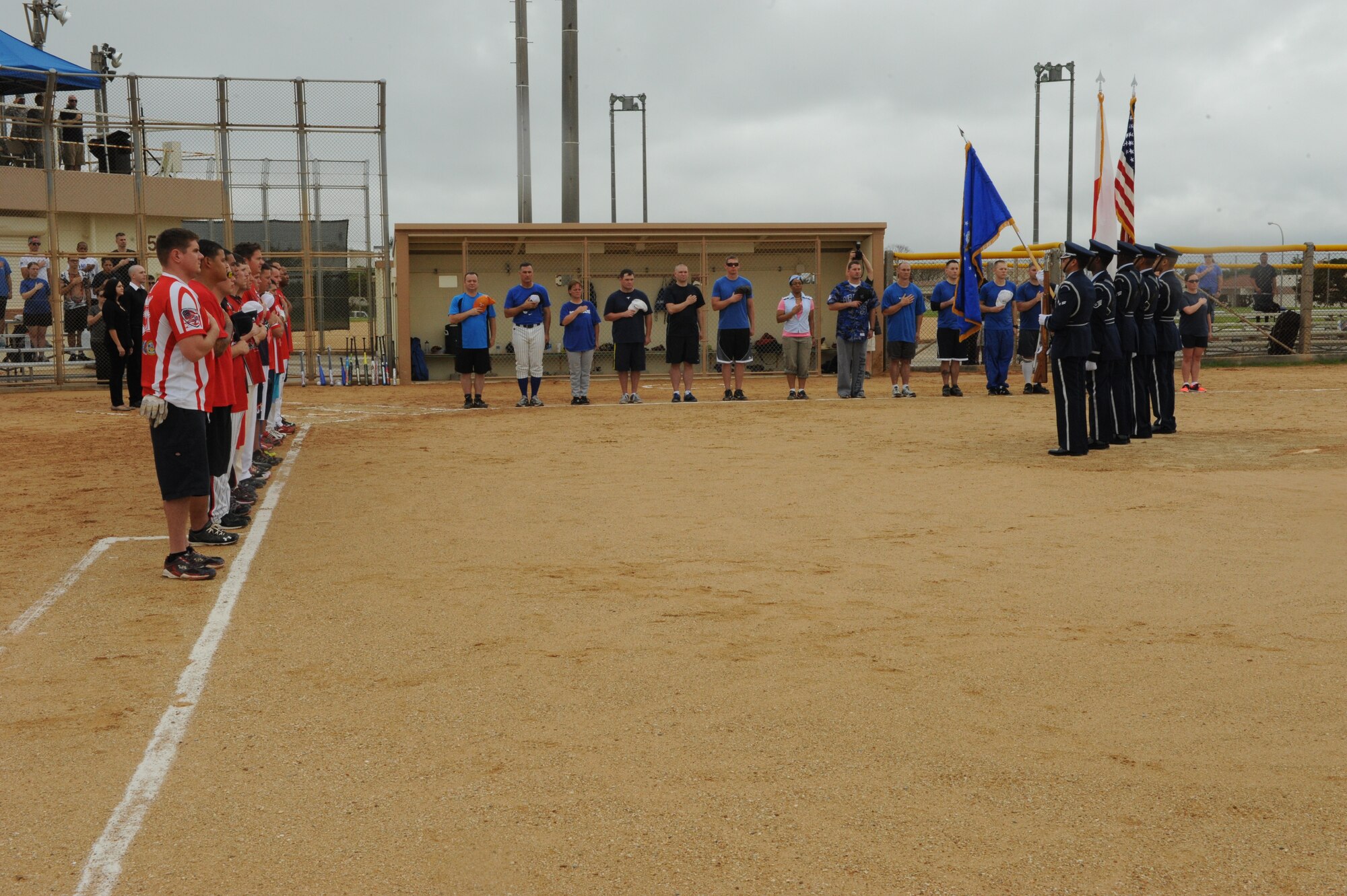The Kadena Air Base Honor Guard presents colors to start the Stars Versus Stripes softball game on Kadena Air Base, Japan, May 19, 2014. The Stars Versus Stripes game kicked-off Safety and Wingmanship Day, and was the first officers vs. enlisted game of its kind on Kadena. (U.S. Air Force photo by Airman 1st Class Stephen G. Eigel)