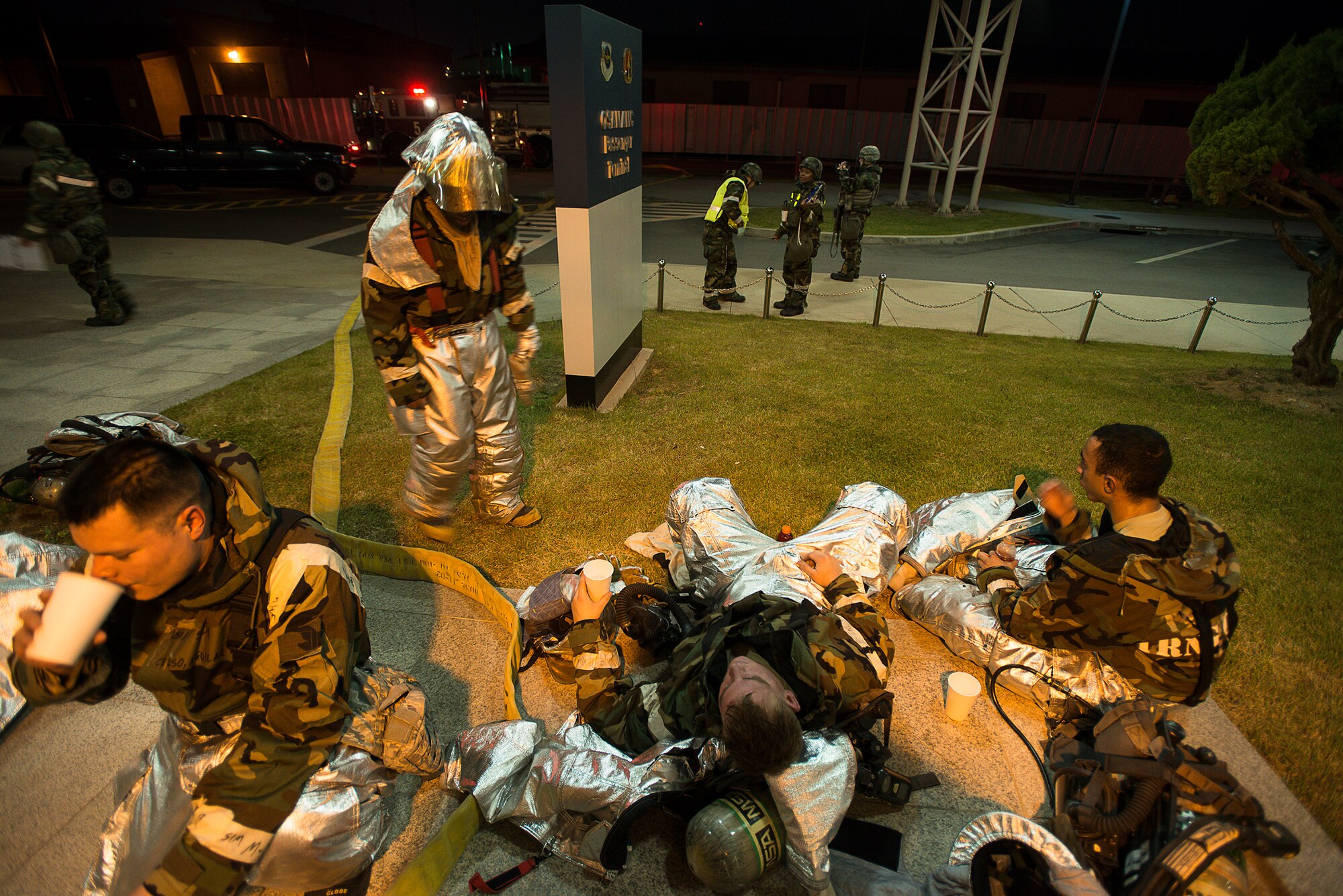 51st Civil Engineer Squadron Firefighters rest after completing a simulated mass casualty exercise May 6, 2014, at Osan Air Base, Republic of Korea. In addition to constant training, firefighters are required to respond to a variety of emergency calls on base. (U.S. Air Force photo by Staff Sgt. Jake Barreiro)