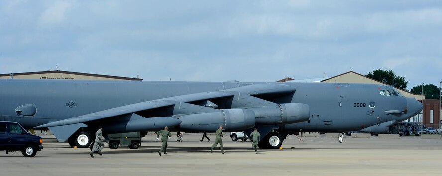 Aircrew members scramble to launch a B-52H Stratofortress during exercise Constant Vigilance at Barksdale Air Force Base, La.,  May 19, 2014. Numerous B-52s were launched simultaneously using minimum interval takeoff procedures to demonstrate how quickly the aircraft can respond and deliver precision munitions to the battlefield. (U.S. Air Force photo/Senior Airman Joseph A. Pagán Jr.)
