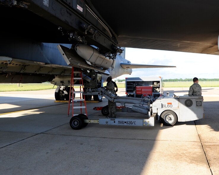 A four-man weapons load crew team installs a training Joint Air-to-Surface Standoff Missile on the wing of a B-52H Stratofortress during at Barksdale Air Force Base, La., during Global Lightning/Constant Vigilance May 14, 2014. Air Force Global Strike Command conducts training operations and exercise on a regular basis ensure forces are ready to perform nuclear deterrence operations and long-range strike missions if and when called upon to do so. (U.S. Air Force photo/Senior Airman Joseph A. Pagán Jr.)