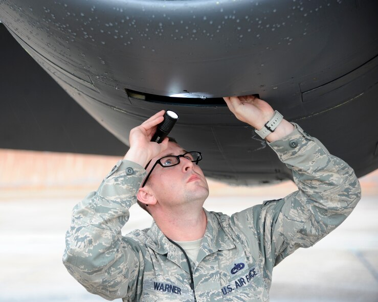 Tech. Sgt. Matthew Warner, 2nd Maintenance Group quality assurance inspector at Barksdale Air Force Base, La., checks the auxiliary air inlet door on an engine of a B-52H Stratofortress while participating in Global Lightning/Constant Vigilance 2014 May 13, 2014. Warner was part of a quality assurance team tasked to inspect maintainers work as aircraft were generated during the exercise. (U.S. Air Force photo/Senior Airman Joseph A. Pagán Jr.)