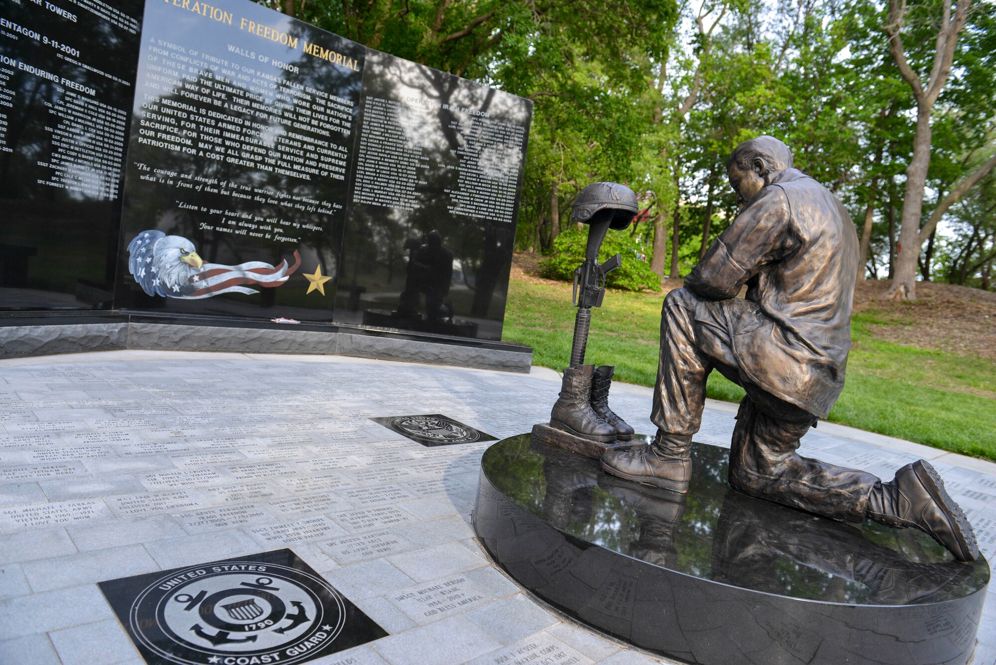 The Operation Freedom Memorial sits among many other war memorials in the Veteran’s Memorial Park, May, 18, 2014, in Wichita, Kansas. The monument is a symbol of tribute to Kansas fallen service members from Operation Desert Storm to current, ongoing conflicts in the war on terrorism. The gray, granite floor pavers contain the names of people serve or have served in the military. (U.S. Air Force photo/Staff Sgt. Jess Lockoski)