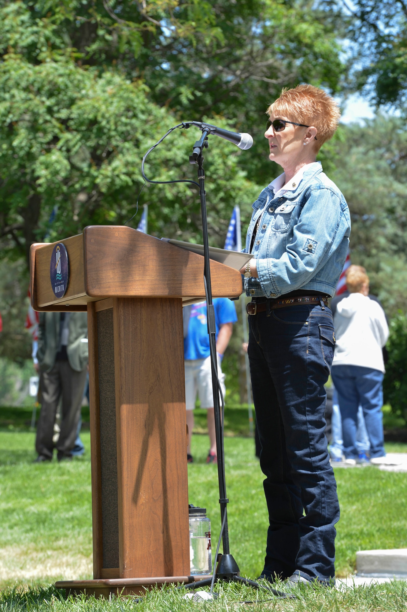 Anita Dixson, a Kansas Gold Star mother and president of the Operation Freedom Memorial Foundation, Inc., addresses audience members attending the new Operation Freedom Memorial, during a dedication ceremony, May, 17, 2014, in Wichita, Kansas. She started the foundation after losing her son, U.S. Army Sgt. Evan Parker who died in 2005 from wounds suffered while deployed in Iraq. (U.S. Air Force photo/Staff Sgt. Jess Lockoski)