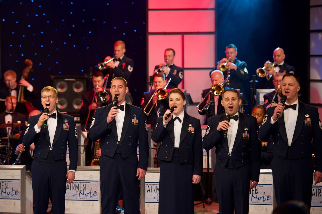Members of The Singing Sergeants along with Airmen of Note vocalist TSgt Paige Martin sing for the Maryland Public Television taping of "D-Day at 70: A Salute to the Greatest Generation" (US Air Force photo by SMSgt Kevin Burns/released).