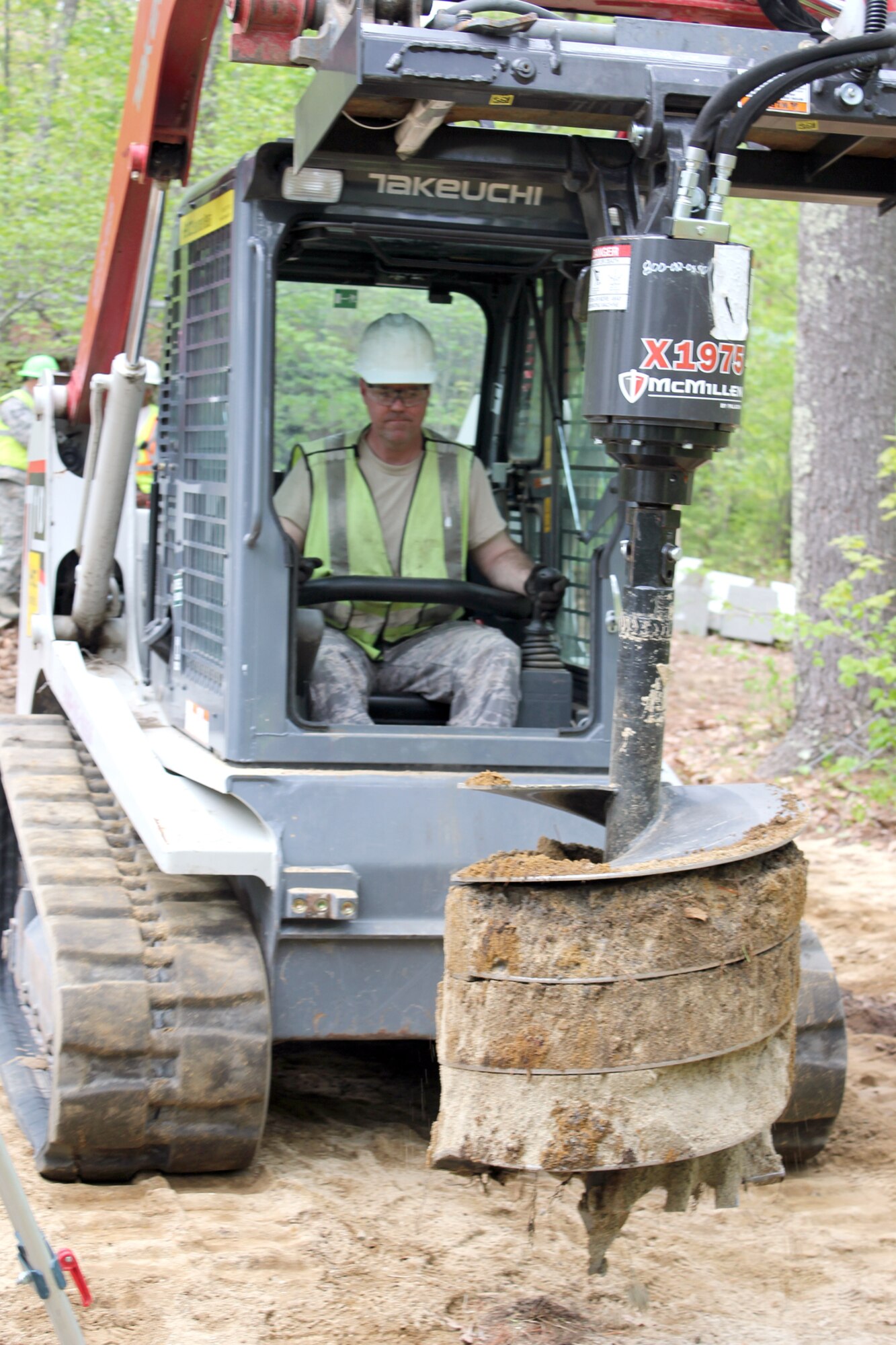 140520-Z-VA676-035 – Senior Airman Edward Peacock uses a small tractor to auger holes for a new cabin at Camp Hind Boy Scout Camp, Raymond, Maine, May 20, 2014. Peacock is a member of the 127th Civil Engineer Squadron, based at Selfridge Air National Guard Base, Mich. The Airmen from Selfridge’s 127th CES, along with Marine Corps Reservists and Army Reservists, are working on various construction projects at the camp during an Innovative Readiness Training mission, which allows military personnel to get training in various tasks and a community organization, in this case the Boy Scouts, to benefit from the work. (U.S. Air National Guard photo by Technical Sgt. Dan Heaton)