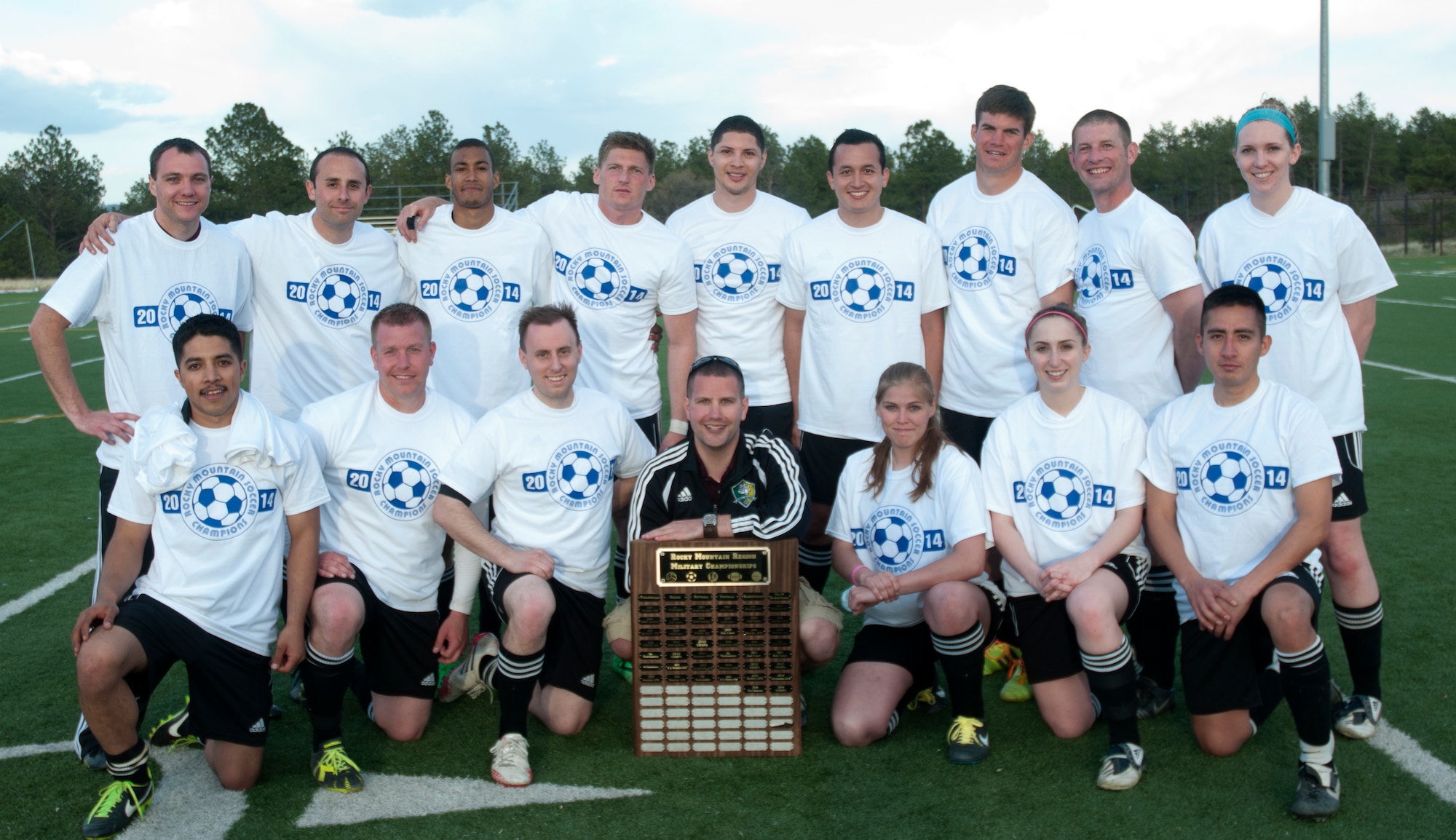 The 90th Missile Wing soccer team takes a group photo with the Rocky Mountain Region Military Championship plaque May 17 after winning the Rocky Mountain Soccer Tournament at the Air Force Academy in Colorado Springs, Colo.  The team beat four other regional teams to achieve victory. F.E. Warren Air Force Base defeated Schriever AFB soccer team 4-0, Fort Collins soccer team A 4-1, USAFA soccer team 3-2 and the Fort Collins soccer team B 2-0. (U.S. Air Force photo by Airman Malcolm Mayfield)