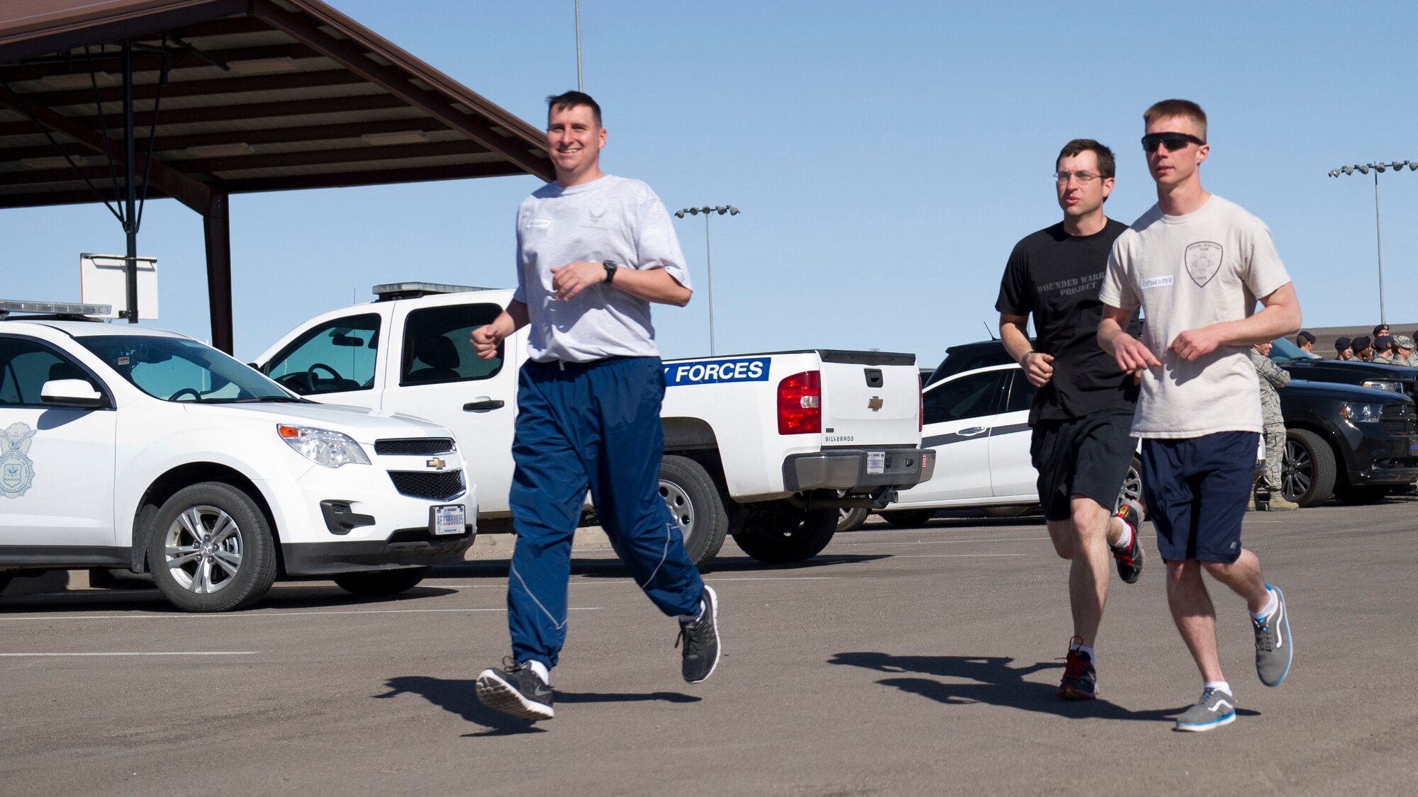 Master Sgt. Joshua Gressett, Staff Sgt. Jon Gally, and Staff Sgt. Nicholas Ruttencutter, members of the 49th Security Forces Squadron, begin their National Police Week 5K run at Holloman Air Force Base, N.M., May 12.  According to the National Police Week website, President John F.  Kennedy signed a proclamation in 1962 that designated May 15 as Peace Officers Memorial Day and the week in which that date falls as National Police Week.  Since the inception of National Police Week, the United States Air Force has lost 120 military and civilian law enforcement officers. (U.S. Air Force photo by Staff Sgt. E’Lysia Wray/Released)