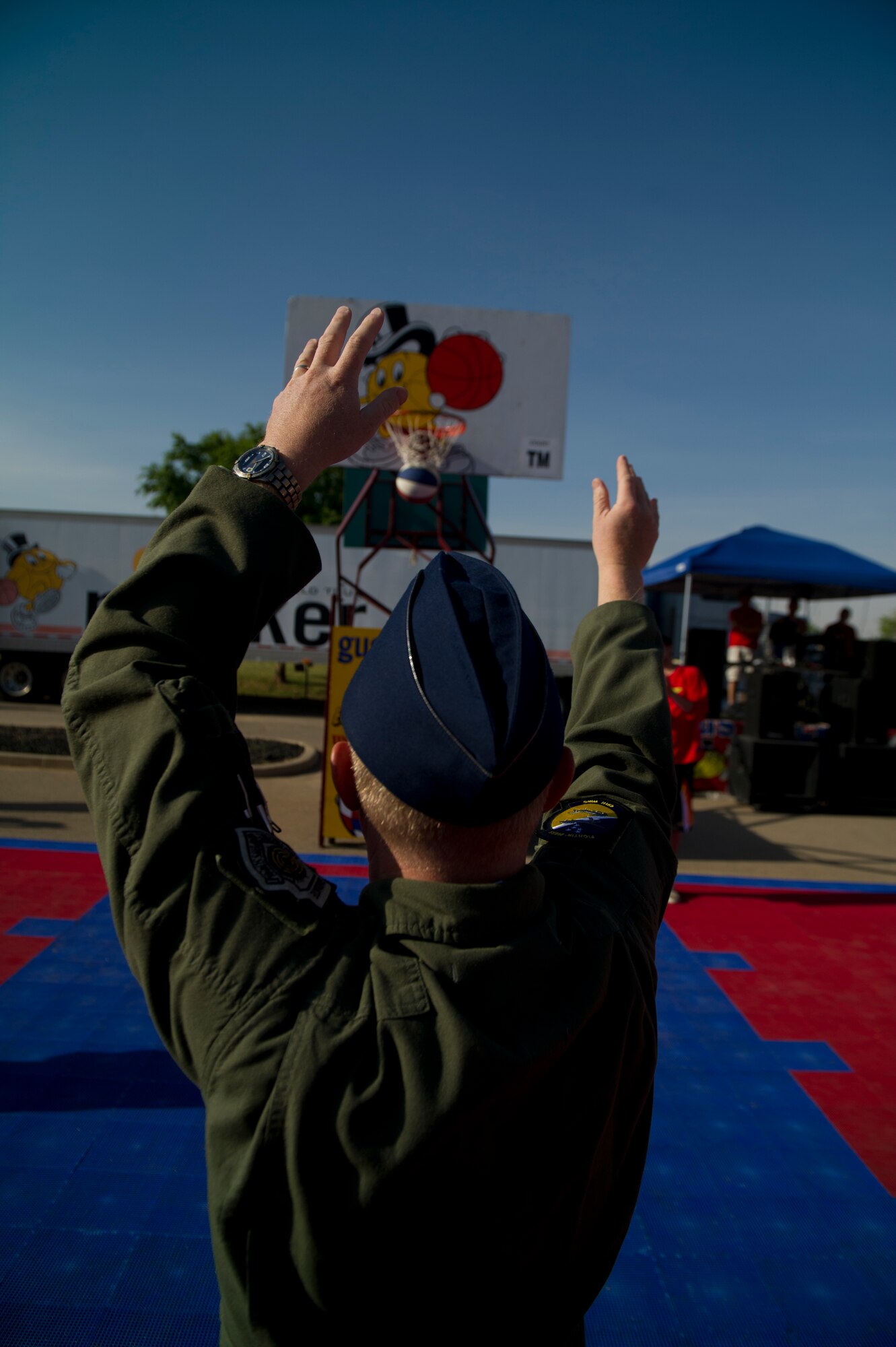 Colonel Andrew Croft, 49th Wing commander, shoots a free throw to kick off the Gus Macker 3-on-3 Basketball Tournament during Armed Forces Day at Alamogordo, N.M., May 17. Airmen from Holloman Air Force Base, N.M., provided a model aircraft static display to showcase the missions to visitors. Armed Forces Day is celebrated annually on the third Saturday of May to pay tribute to men and women who serve in the United States armed forces. (U.S. Air Force photo by Airman 1st Class Aaron Montoya / Released)