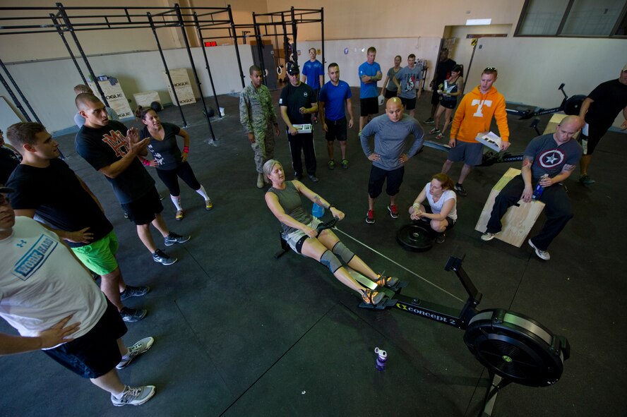 A member of Team Holloman participates in the rowing portion of the Fittest Wingmen Throwdown 2 at Holloman Air Force Base, N.M., May 16. The Fittest Wingmen Throwdown competition rated Airmen’s performance across various CrossFit exercises to ultimately decide a winning team of more than 20 participants. (U.S. Air Force photo by Airman 1st Class Aaron Montoya / Released)
