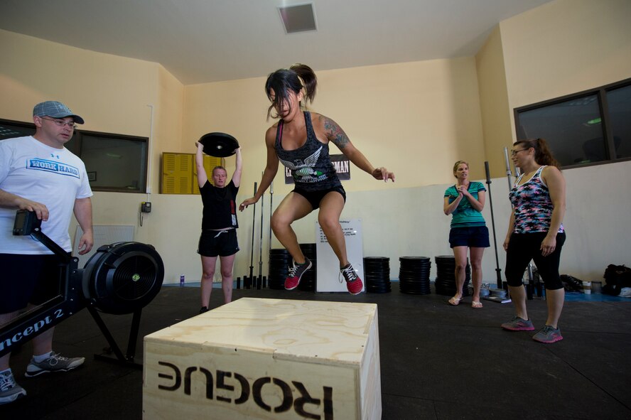 A member of Team Holloman executes a box jump as part of the Fittest Wingmen Throwdown 2 at Holloman Air Force Base, N.M., May 16. The Fittest Wingmen Throwdown competition rated Airmen’s performance across various CrossFit exercises to ultimately decide a winning team of more than 20 participants. (U.S. Air Force photo by Airman 1st Class Aaron Montoya / Released)