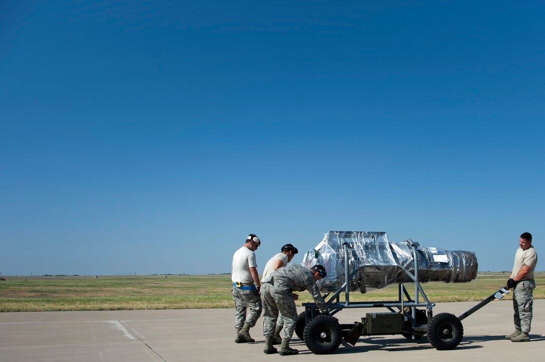 Airmen from Altus Air Force Base, Okla., pitched in to help load and inspect equipment and tools onto a C-130 Hercules supplied by Dyess AFB, Texas, May 11, 2014. Through the help of Dyess and Atlus, members of Sheppard’s own 88th Fighter Training Squadron were able to make the trip down to Florida to provide air-to-air combat simulation presentations for the Florida Air National Guard. The trip provides training to both the FANG and the instructor pilots from Sheppard AFB, Texas. (U.S. Air Force photo/Airman 1st Class Robert L. McIlrath)





 

