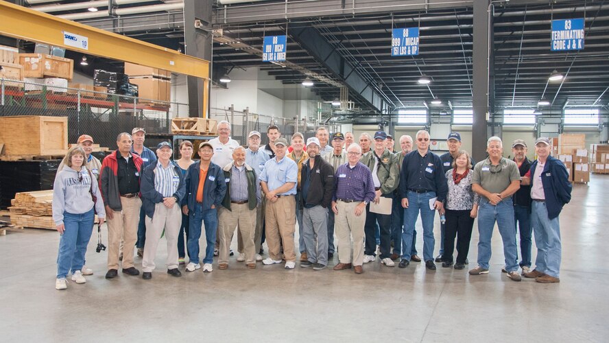 Civilian pilots pose for a group shot during the Dover Air Force Base Mid-Air Collision Avoidance Fly-in May 17, 2014, at Dover AFB, Del. The pilots toured some of Dover AFB’s facilities to get a better understanding of Team Dover’s mission and the importance of communications between them and DAFB. (U.S. Air Force photo/Senior Airman Jared Duhon) 