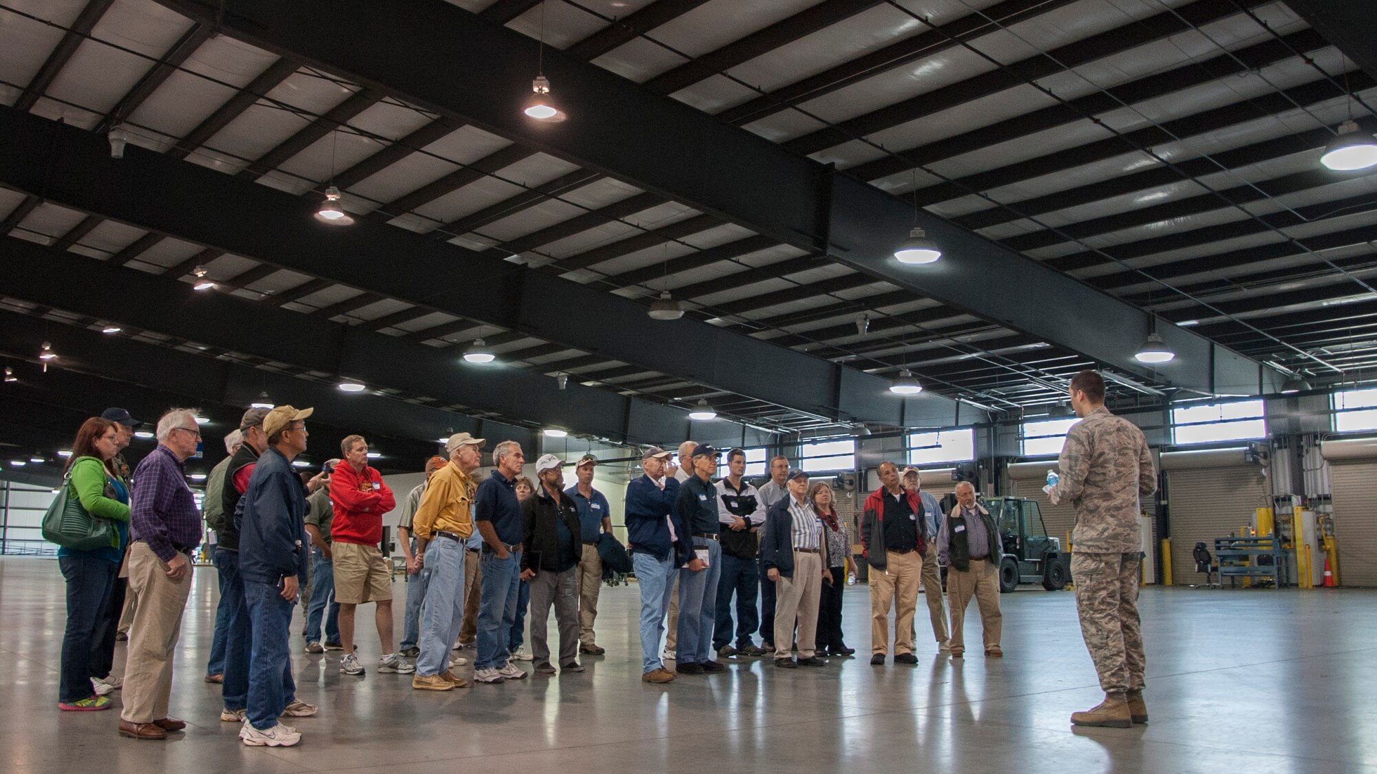 Civilian pilots receive a tour of the 436th Aerial Port Squadron during the Dover Air Force Base Mid-Air Collision Avoidance Fly-in May 17, 2014, at Dover AFB, Del. The 436th APS is in charge of processing cargo that is then shipped across the world and was shown to the pilots to help them understand Team Dover’s mission. (U.S. Air Force photo/Senior Airman Jared Duhon) 