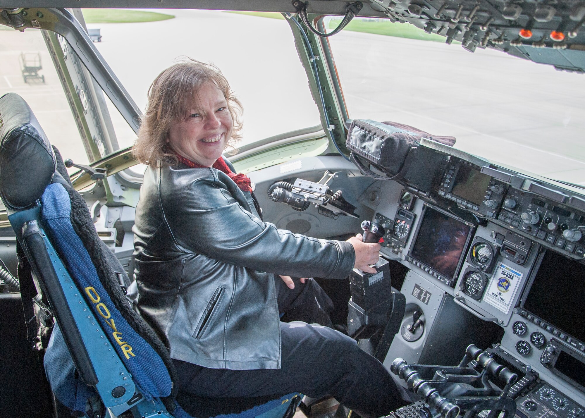 Kay Rudo, wife of Mark Rudo, prior honorary commander, sits in the pilot’s seat of a C-17 Globemaster III during the Dover Air Force Base Mid-Air Collision Avoidance Fly-in May 17, 2014, at Dover AFB. The static display was part of a tour civilian pilots received to help them understand how communications helps both them and DAFB. (U.S. Air Force photo/Senior Airman Jared Duhon) 