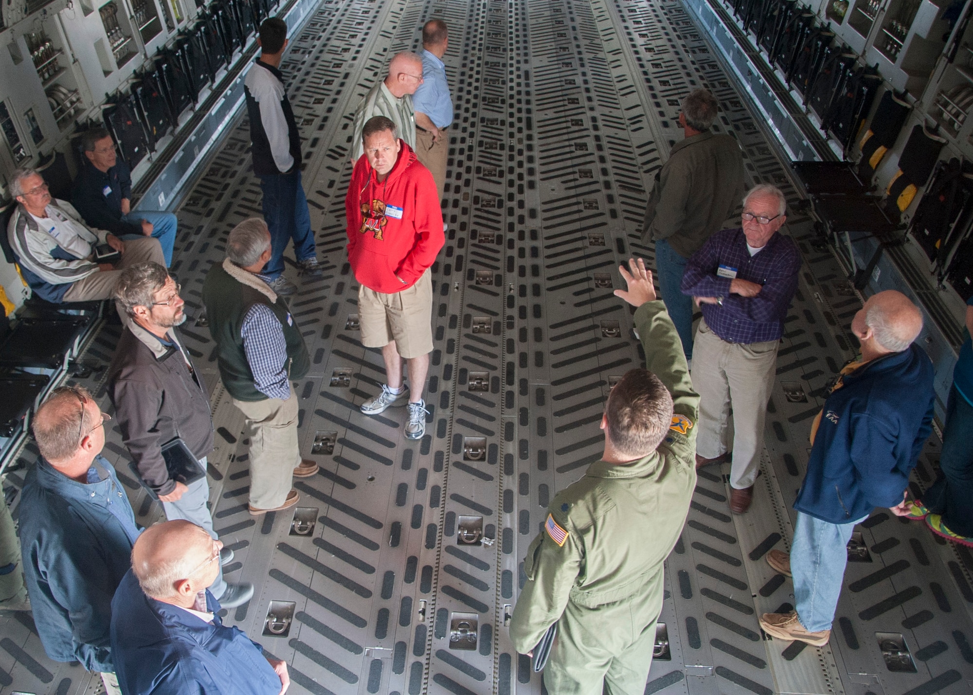 Lt. Col. Jason Mills 436th Airlift Wing chief of safety, talks with pilots about the characteristics of a C-17A Globemaster III during the Dover Air Force Base Mid-Air Collision Avoidance Fly-in May 17, 2014, at Dover AFB, Del. Civilian aircraft are generally small single-engine planes that cruise between 75 and 100 knots while Dover AFB’s C-5M Supergalaxies  and C-17s regularly conduct training at 210 to 250 knots. (U.S. Air Force photo/Senior Airman Jared Duhon)