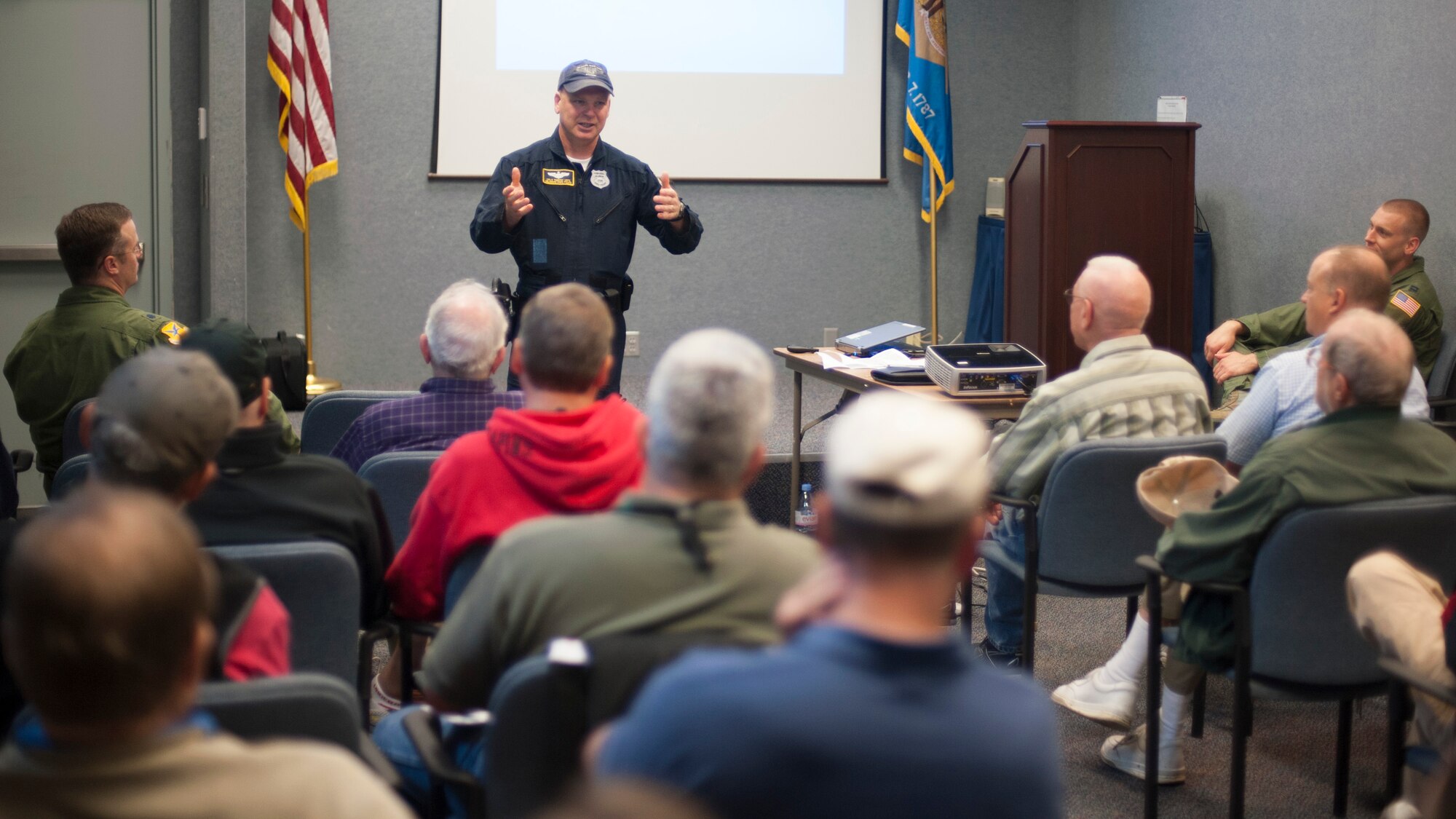 Cpl. Timothy Lintz, Delaware State Trooper, talks with pilots during the Dover Air Force Base Mid-Air Collision Avoidance Fly-in May 17, 2014, at the Air Mobility Command Museum on Dover AFB, Del. The Troopers and Team Dover teamed up to teach civilian pilots about DAFB airspace. (U.S. Air Force photo/Senior Airman Jared Duhon) 