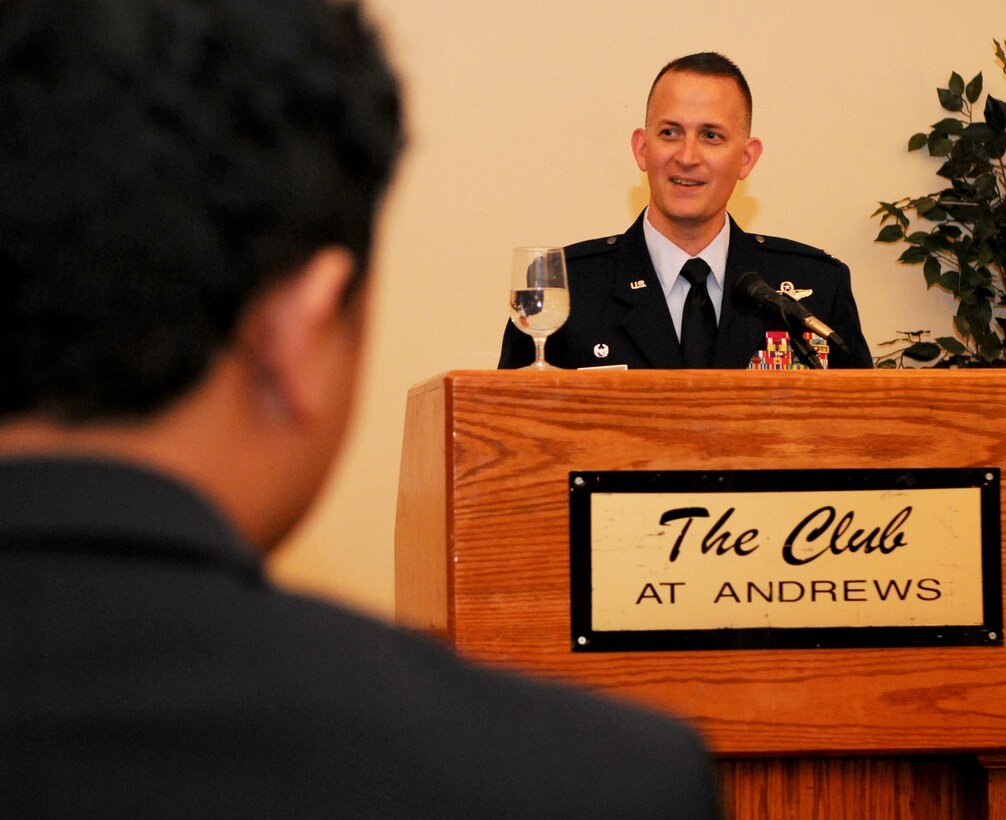 Col. Bill Knight, 11th Wing commander, speaks during the Andrews Officers Spouses’ Club scholarship presentation at The Club on Joint Base Andrews, Md., May 17, 2014. Applicants were judged in seven categories and have to submit two letters of recommendation in order to compete for a scholarship. (U.S. Air Force photo/Airman 1st Class Ryan J. Sonnier)