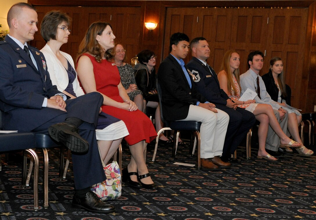 Team Andrews members await the start of the Andrews Officers Spouses’ Club scholarship presentation at The Club on Joint Base Andrews, Md., May 17, 2014. Volunteers at the AOSC Thrift Shop raised the scholarship money. (U.S. Air force photo/Airman 1st Class Ryan J. Sonnier)