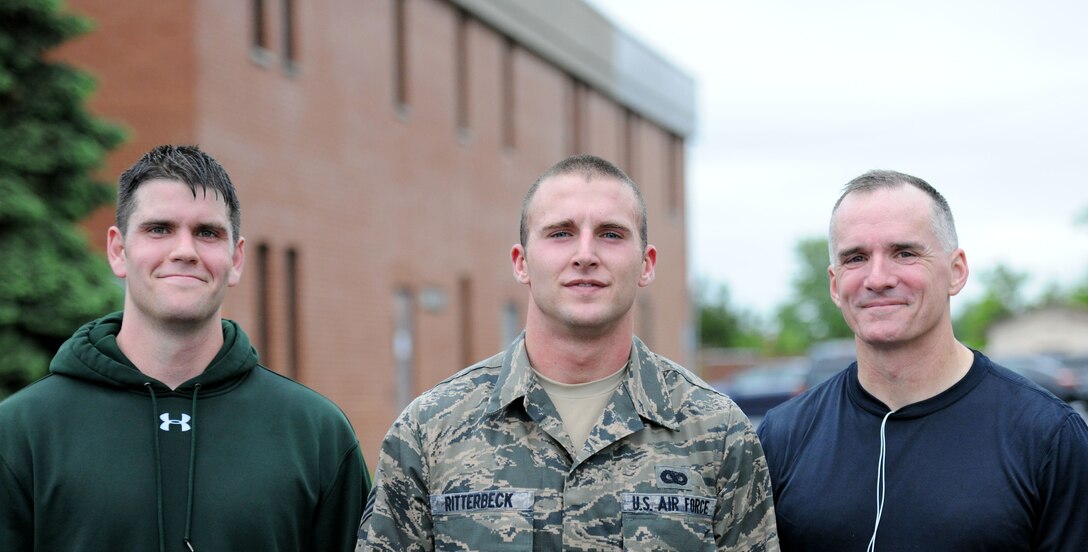 Senior Airman Albert Ritterbeck, center, was the first place winner of the annual ruck march held during National Police Week on Joint Base Andrews, Md., May 16, 2014. Col. Erik Goepner, right, was the second place finisher and Capt. Sean Callahan finished third. Ritterbeck is an 811th Security Forces Squadron Raven, Goepner is the 11th Security Forces Group commander and Callahan is a 1st Helicopter Squadron pilot. (U.S. Air Force photo/Airman 1st Class Ryan J. Sonnier)