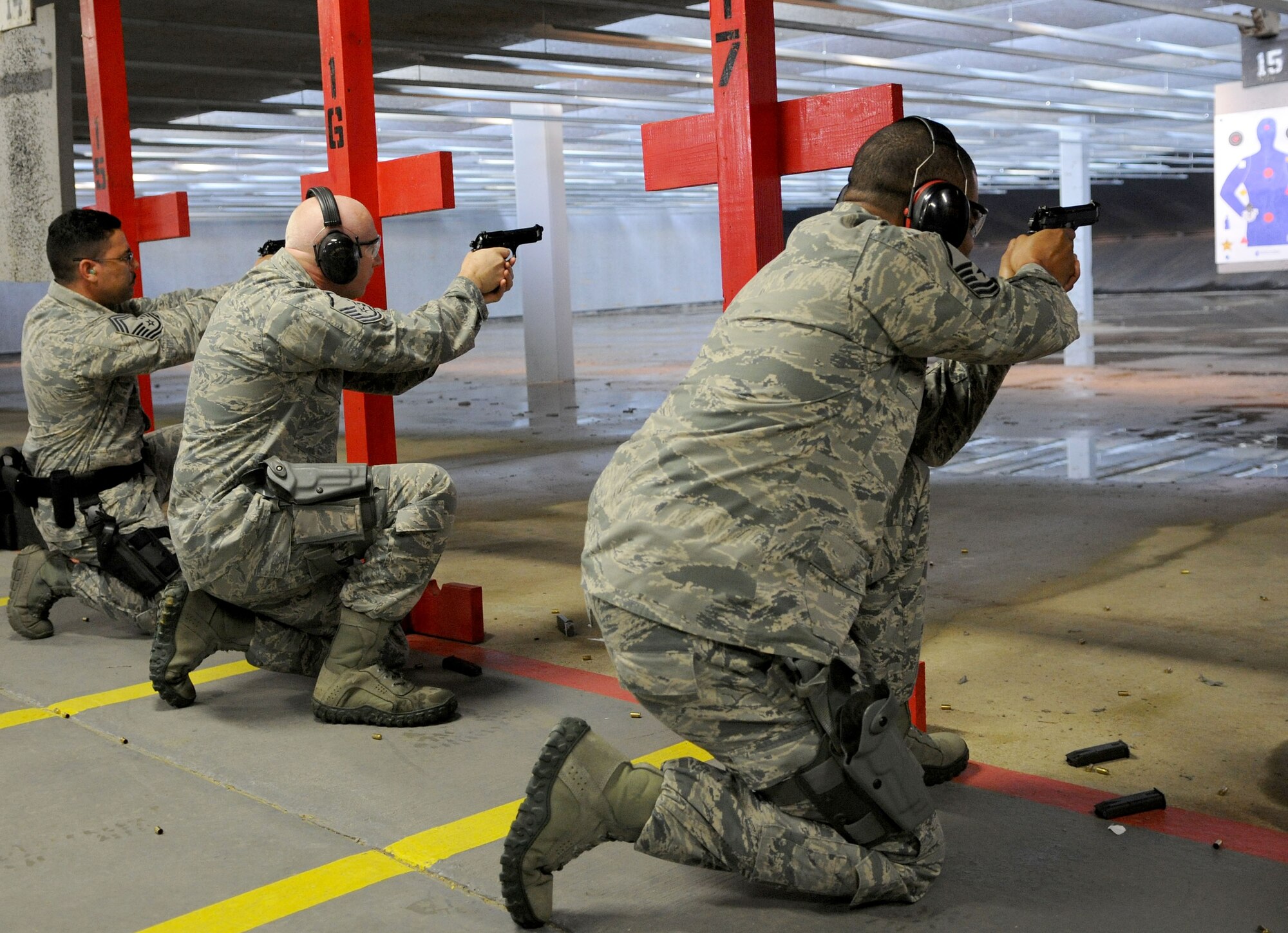 Security forces members compete in a shooting competition during National Police Week on Joint Base Andrews, Md., May 16, 2014. (U.S. Air Force photo/Airman 1st Class Ryan J. Sonnier)