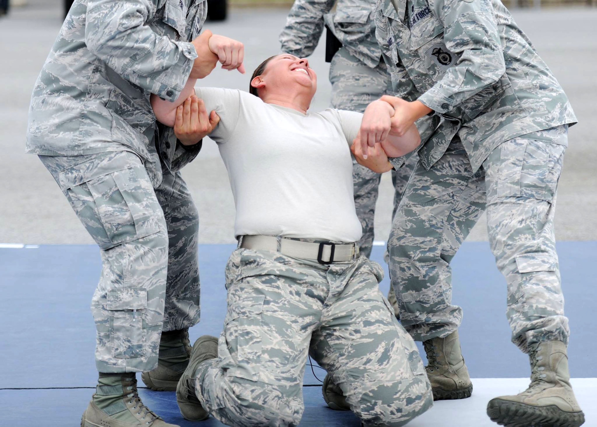 Staff Sgt. Darlin Ducos, 11th Security Forces Squadron desk sergeant, gets tased during a demo day on Joint Base Andrews, Md., May 12, 2014. The event was held during National Police Week which recognizes those who have fallen. (U.S. Air Force photo/Airman 1st Class Ryan J. Sonnier)