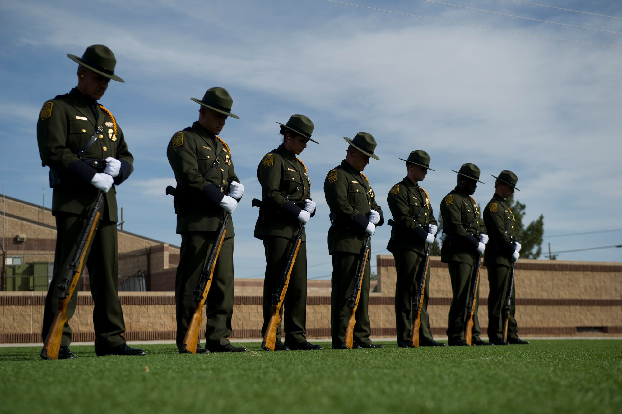 The U.S. Border Patrol Honor Guard stages in preparation for the 21-gun salute during the Police Week closing ceremony at Holloman Air Force Base, N.M., May 16. According to the National Police Week website, President John F.  Kennedy signed a proclamation in 1962 that designated May 15 as Peace Officers Memorial Day and the week in which that date falls as National Police Week. Since the inception of National Police Week, the United States Air Force has lost 120 military and civilian law enforcement officers. (U.S. Air Force photo by Airman 1st Class Aaron Montoya / Released)