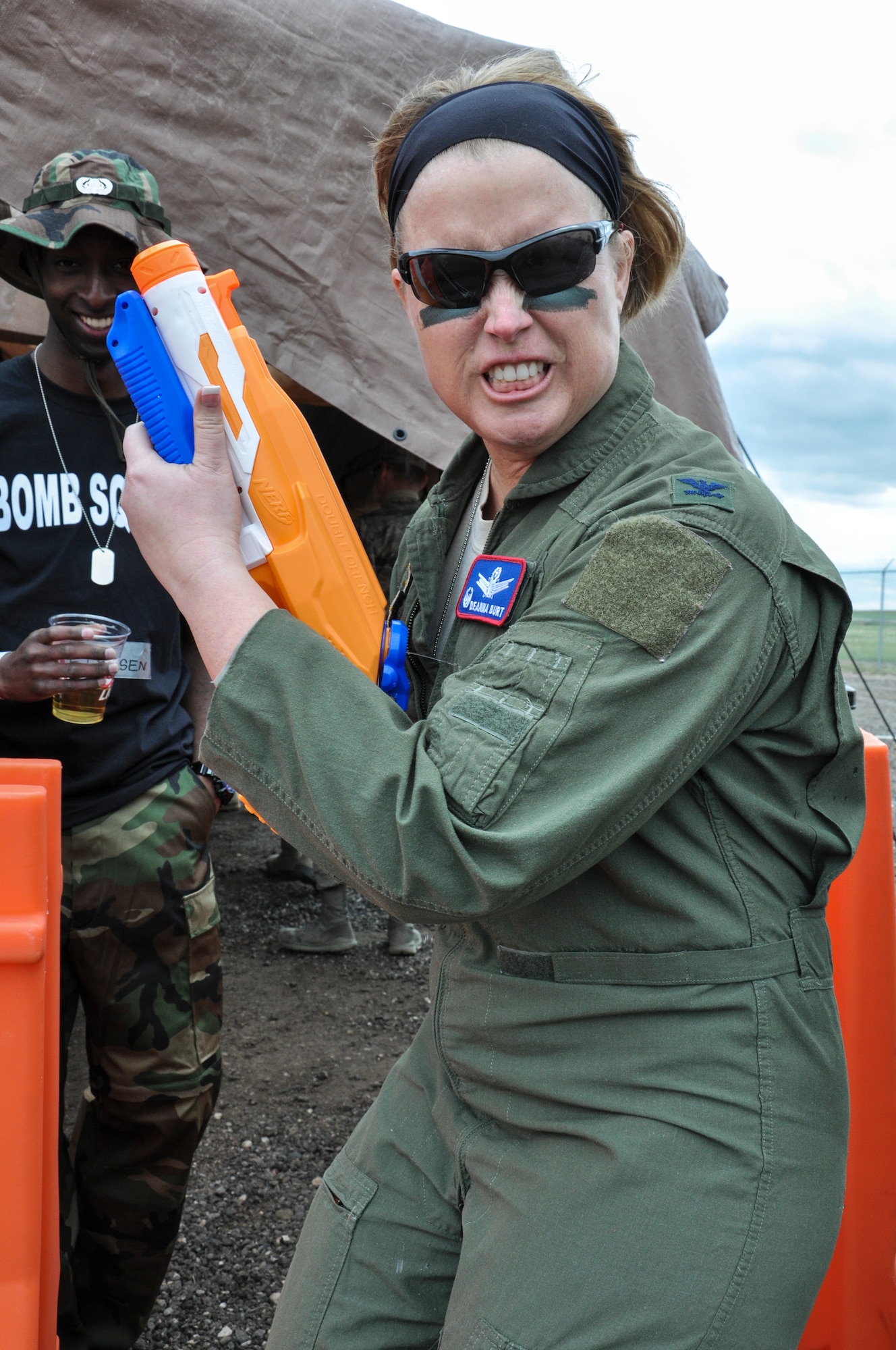 Col. DeAnna Burt, 460th Operations Group commander, poses before the Combat Dining Out festivities kick off May 16, 2014, at Camp Rattlesnake on Buckley Air Force Base, Colo. The dining out brought all members of the base together for water battles, an obstacle course, camaraderie and some good, clean fun. (U.S. Air Force photo by Staff Sgt. Nicholas Rau/Released) 
