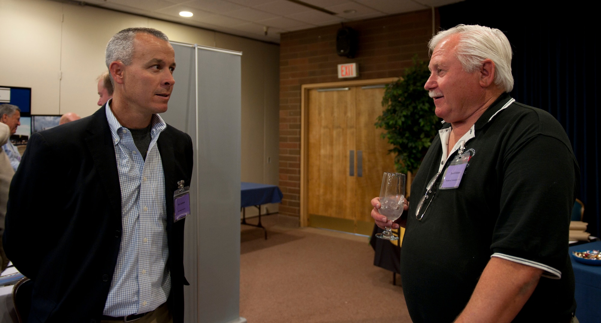 Mel Jackson and David Holman, vendors attending the Meet and Greet, discuss business opportunities during the Meet and Greet May 19, 2014, at Mountain Home Air Force Base, Idaho. The Meet and Greet is unique to the base, and could become an annual event. (U.S. Air Force photo by Airman 1st Class Malissa Lott/RELEASED)
