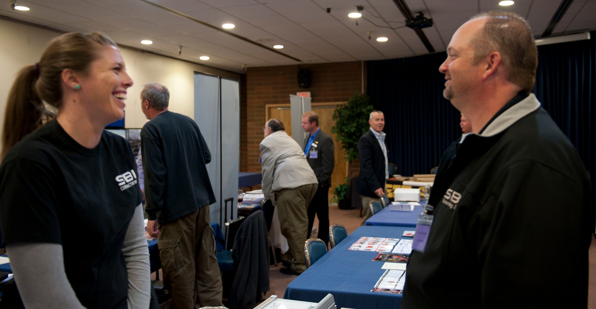 Anita Schafer and Trevor Chadwick, local vendors, speak during the Meet and Greet hosted by the 366th Contracting Squadron May 19, 2014, at Mountain Home Air Force Base, Idaho. Small business participation and robust competition is essential to meet customer needs, while effectively maximizing taxpayer dollars. (U.S. Air Force photo by Airman 1st Class Malissa Lott/RELEASED)