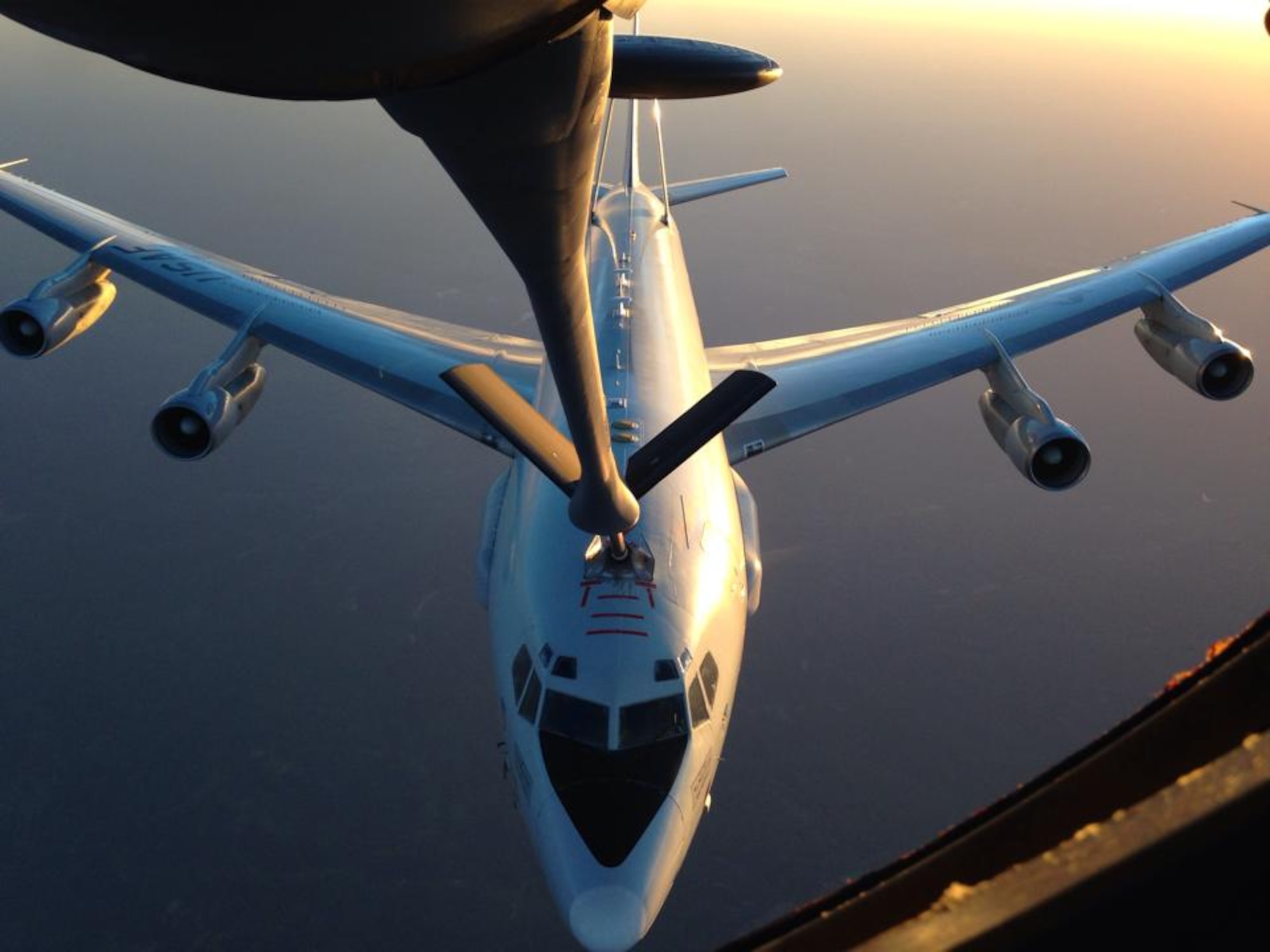 Refueling at sunset!  An E-3 Sentry airborne warning and control system (AWACS) from the 513th Air Control Group, Tinker Air Force Base, Okla., is refueled by a KC-135 Stratotanker from McConnell Air Force Base, Kan., May 19, 2014.  The KC-135 aircrew was made up of Reservists from the 931st Air Refueling Group at McConnell.  (U.S. Air Force photo by Senior Master Sgt. Ray Lewis)