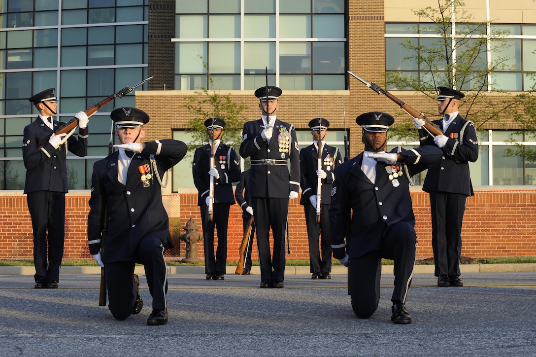 The USAF Honor Guard drill team performs during the Joint Base Andrews Heritage Park Concert, May 17, 2014. The free concert included a performance by Max Impact, the premier rock band of the Air Force, a UH-1N Huey Helicopter display and an explosive ordnance bomb disposal robot. (U.S. Air Force photo/Senior Airman Mariah Haddenham)