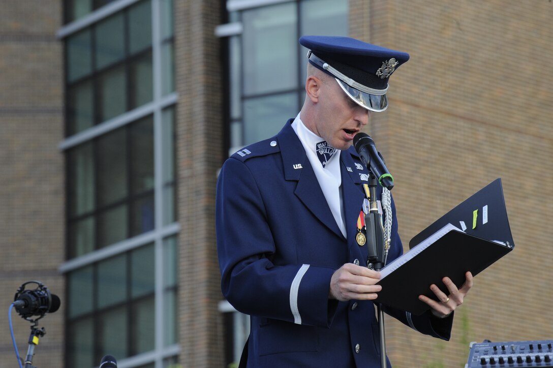 Capt. Alan Morford, USAF Honor Guard drill team commander, gives opening remarks prior to the Air Force Honor Guard drill team performance during the Joint Base Andrews Heritage Park Concert, May 17, 2014. The free concert included a performance by Max Impact, the premier rock band of the Air Force, a UH-1N Huey Helicopter display and an explosive ordnance bomb disposal robot. (U.S. Air Force photo/Senior Airman Mariah Haddenham)