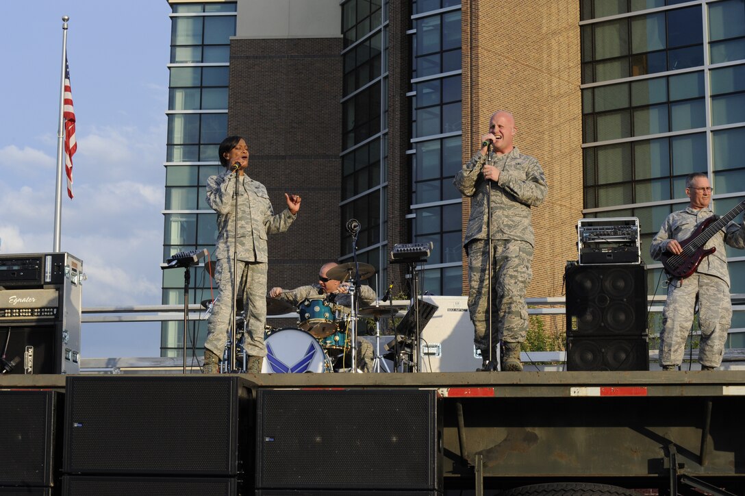 Max Impact, the premier rock band of the Air Force, performs during the Joint Base Andrews Heritage Park Concert, May 17, 2014. The free concert included a performance by the USAF Honor Guard drill team, a UH-1N Huey Helicopter display and an explosive ordnance bomb disposal robot. (U.S. Air Force photo/Senior Airman Mariah Haddenham)