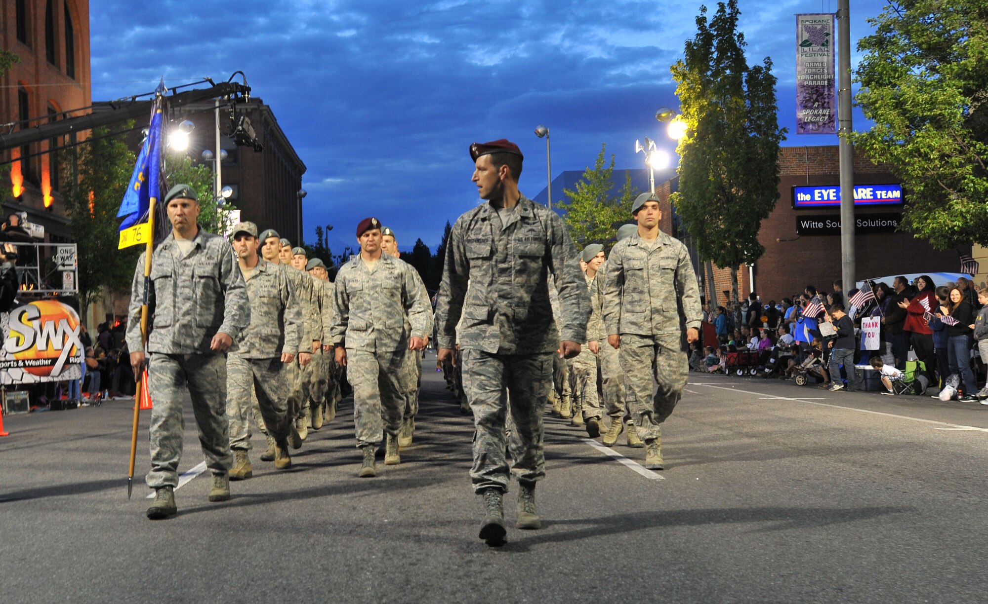 Members from the 336th Training Group Survival, Evasion, Resistance and Escape school march during the Lilac Festival 2014 Armed Forced Torchlight Parade in Spokane Wash., May 17, 2014. The 75-year-old tradition is made to honor service members of both the past and present. Thomas is the 336th Training Group commander. (U.S. Air Force photo by Staff Sgt. Veronica Montes/Released) 