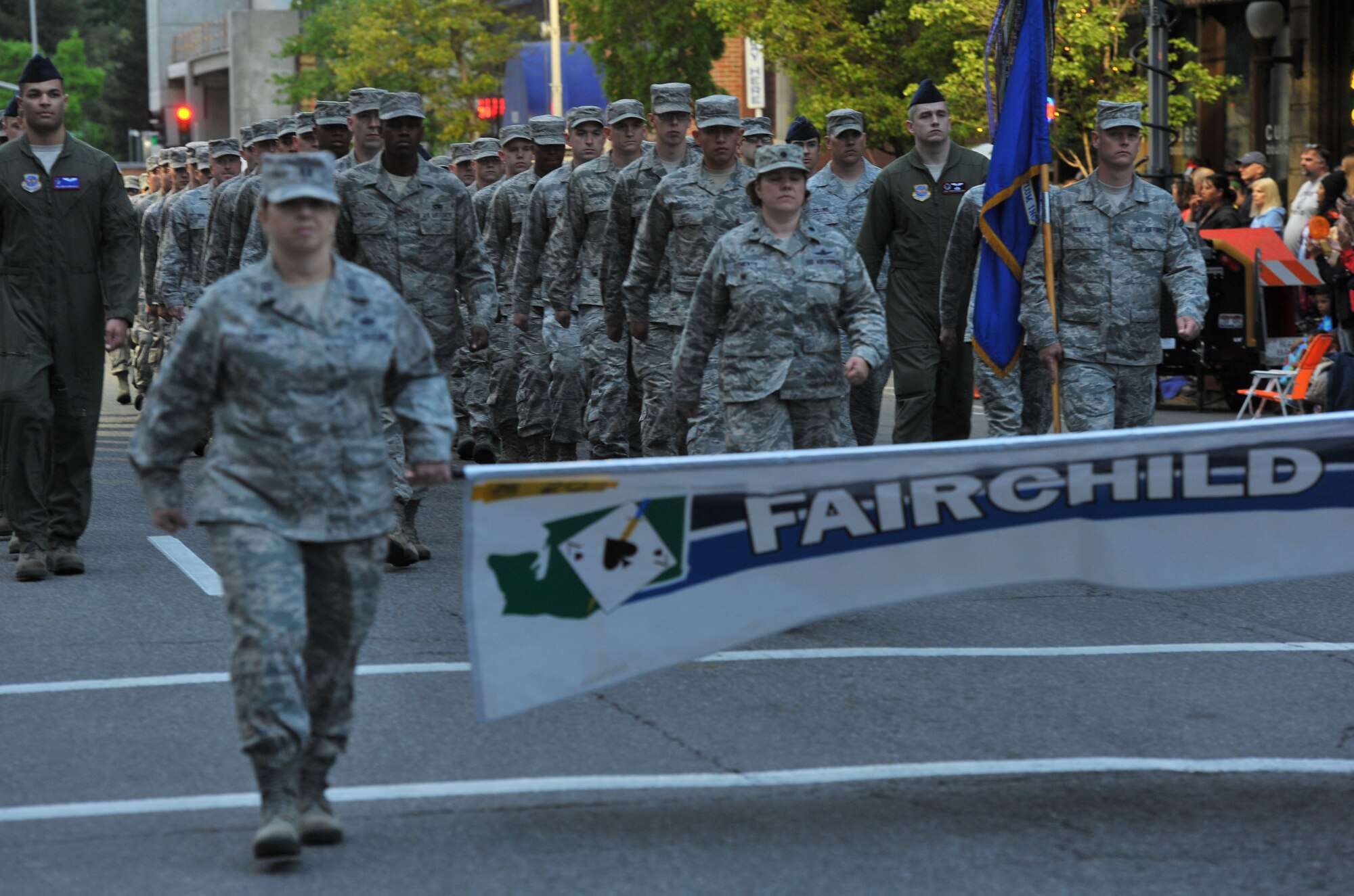 Members from Team Fairchild represent the base the during Lilac Festival 2014 Armed Forced Torchlight Parade in Spokane Wash., May 17, 2014. This parade is the largest armed forces torchlight parade in the nation.  (U.S. Air Force photo by Staff Sgt. Veronica Montes/Released)