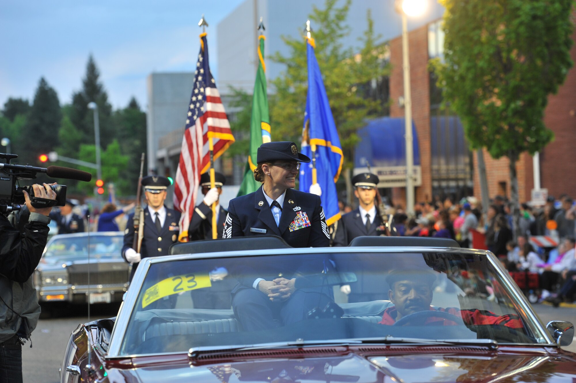 Chief Master Sgt. Wendy Hansen represents Team Fairchild during the Lilac Festival 2014 Armed Forced Torchlight Parade in Spokane Wash., May 17, 2014. The 75-year-old tradition is made to honor service members of both the past and present. Hansen is the 92nd Air Refueling Wing command chief. (U.S. Air Force photo by Staff Sgt. Veronica Montes/Released) 