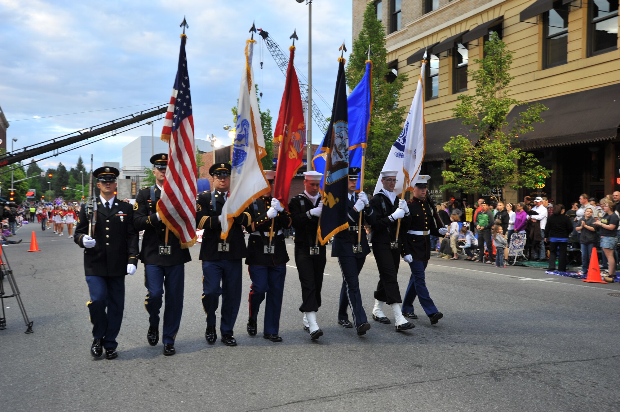 A joint-service color guard team kicks off the Lilac Festival 2014 Armed Forced Torchlight Parade in Spokane Wash., May 17, 2014. The 75-year-old tradition is made to honor service members of both the past and present. (U.S. Air Force photo by Staff Sgt. Veronica Montes/Released) 