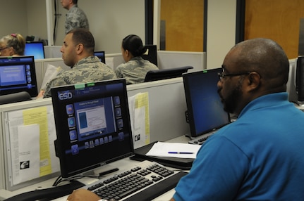 Mance Clark, 902nd Security Force Squadron Joint Base San Antonio- Randolph tests the new Virtual Enterprise Service Desk application for the first time. The product, also known as vESD, is a client-based application that serves as a communication platform between the Enterprise Service Desk and all 850 thousand plus users in the Air Force network. Currently, the product is going through a trial period and is expected to be released in October 2014. (U.S. Air Force photo/ Senior Airman Lynsie Nichols)