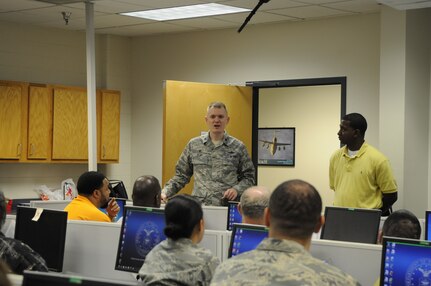 Lt. Col. Mark Reith, 690th Network Support Squadron unit commander Joint Base San Antonio- Lackland Kelly Field Annex, briefs the members of a select test group for the Virtual Enterprise Service Desk application. The product, also known as vESD, is a client-based application that serves as a communication platform between the Enterprise Service Desk and all 850 thousand plus users in the Air Force network. Currently, the product is going through a trial period and is expected to be released in October 2014. (U.S. Air Force photo/ Senior Airman Lynsie Nichols)