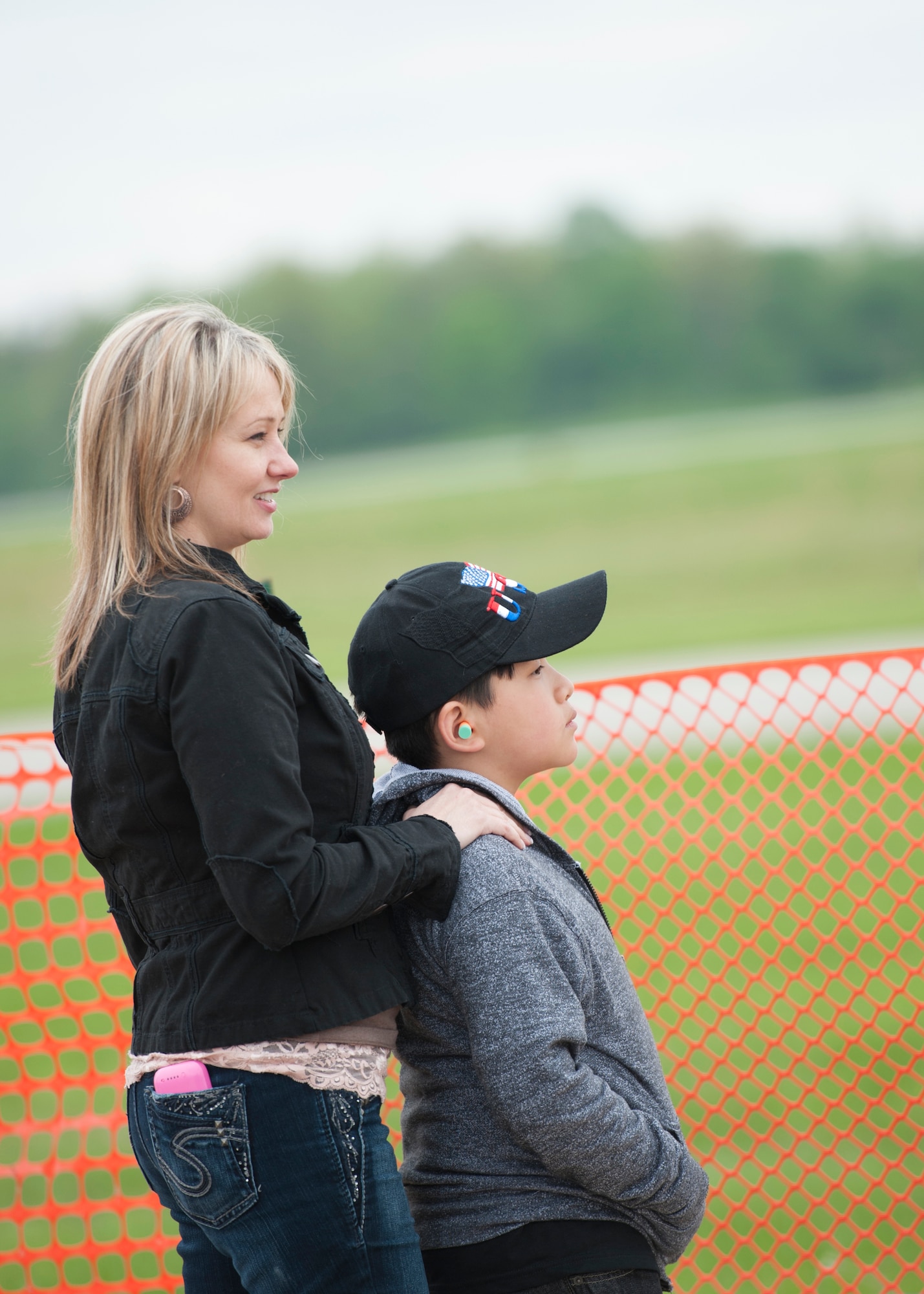 Marcella Zinz stands behind her son Henry watching the U.S. Air Force Thunderbirds land after a performance on May 16, 2014 here. The Zinz, along with several other families from Akron Children’s Hospital Boardman, were treated to VIP seats for the air show preview day and a meet-and-greet with the Thunderbirds. The Thunderbirds came to Youngstown Air Reserve Station to perform at the 2014 Thunder Over the Valley Air Show May 17 and 18. U.S. Air Force photo/Eric M. White