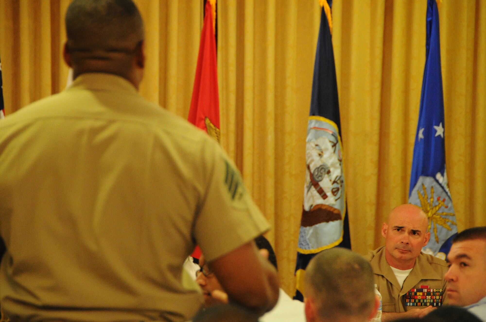 A National Capital Region Marine asks a question to Sgt. Maj. Craig Cressman, Headquarters and Service Battalion HQ Marine Corps, during a joint panel discussion which was part the Joint Professional Development Seminar held on Joint Base Myer-Henderson Hall May 16, 2014. More than 100 NCOs and petty officers from each branch of service across the National Capital Region attended the four-day seminar where they learned about operating in a joint environment.(U.S. Air Force photo/Staff Sgt. Matt Davis)