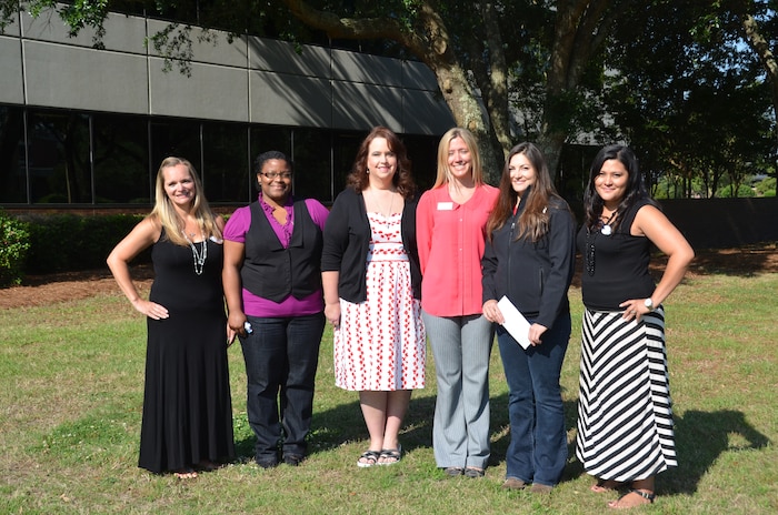 The Team Charleston Spouses Club presented checks totaling more than $6,000 to various base agencies May 20, 2014, at Joint Base Charleston, S.C. On hand to receive the checks on behalf of their organizations are: (Left to right)Tonya Prentiss, Team Charleston Spouse Club president, Brooke Matthews, Joint Base Charleston – Weapons Station Youth Program manager, Kim Walker, COMPASS representative, Shannon Norris, JB Charleston – Air Base Youth Program manager, Eryn Pope, Single Airman Initiative program manager, and Stacy Ledford, TCSC treasurer. The TCSC is open to all services and all ranks, active duty and retired and strives to bring Charleston area military spouses together for social, charitable and educational purposes. (U.S. Air Force photo/Eric Sesit)
